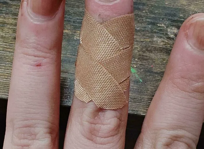 Bandaid Kept Falling Off. Cut The Wings Down The Middle And Cross-Crossed Them And Now It Stays On All Day
