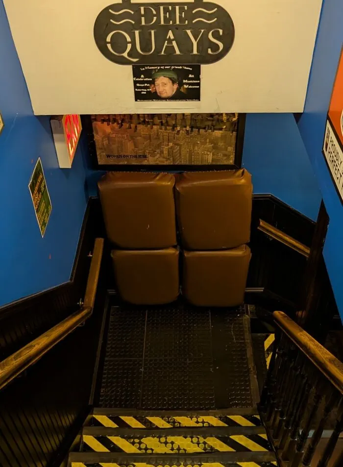 This Pub's Bathroom Is Down A Flight Of Stairs, So They Installed Cushions On The Wall