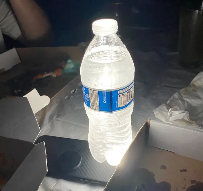 Need More Light When You’re Camping? Put A Water Bottle On Top Of Your Phone Flashlight For A Lantern Effect