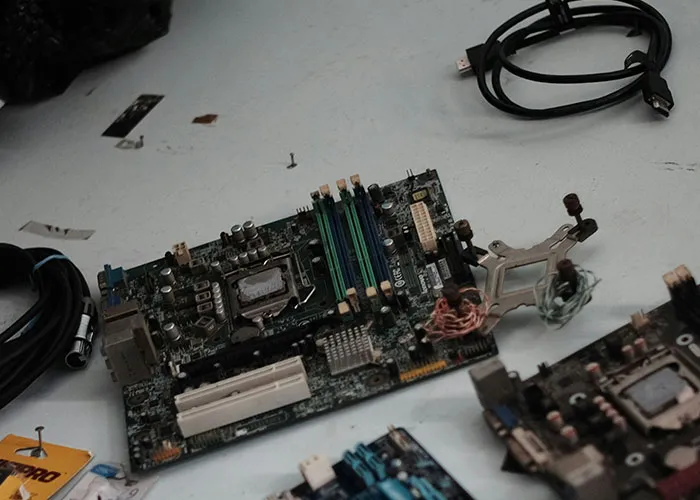 Computer motherboards and cables scattered on a flat surface, unrelated to wild and embarrassing drinking stories.