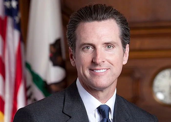 Man in a suit smiling in an office setting, illustrating a total gentleman encounter with a celebrity experience.