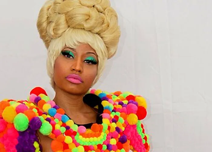 Person in vibrant colorful outfit and elaborate hairstyle, capturing a celebrity encounter with a total gentleman vibe.