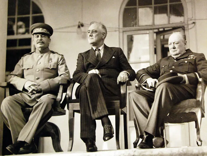 Three world leaders seated together, a striking photo capturing iconic moments in history during a significant event.