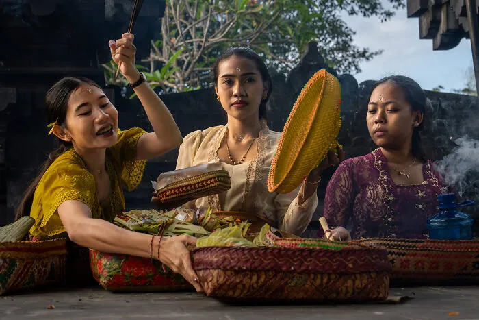 Three Balinese Women With Their Offerings At The Goa Lawah Temple, Or Bat Cave Temple