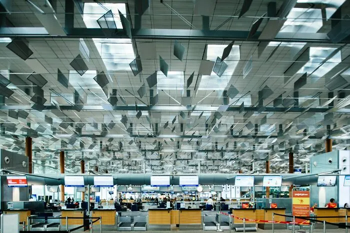Modern airport interior with unique ceiling design, illustrating totally safe things that people can’t stop freaking out about.