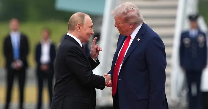 Trump and Putin's Awkward 'Yanking' Handshake Goes Viral Amid Historic Meeting As Body Language Expert Reveals Significance