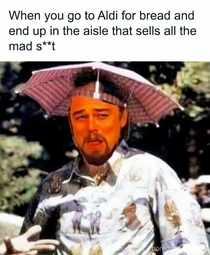 Man with facial expression of confusion wearing a hat-umbrella combo in a chaotic British memes style.