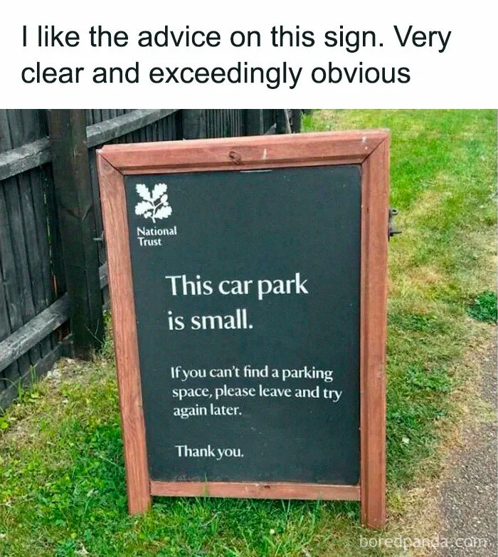 Sign on grass near fence stating the car park is small and advising visitors to leave and try later British memes.