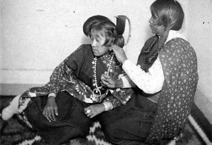 While Teaching On The Hopi Reservation In Arizona, Bratley Likely Posed This Image Of His Student Ruth Honavi Having Her Hair Made Up In The Butterfly Style