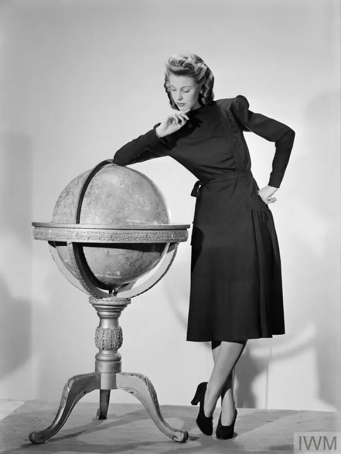 A Model Wearing A Black Woolen Utility Atrima Dress In 1943