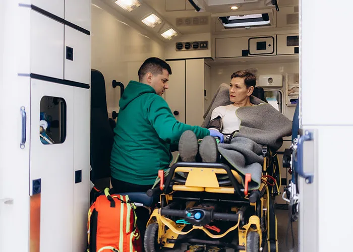 Paramedic attending to a patient on a stretcher inside an ambulance, highlighting doctors getting medical diagnoses wrong.