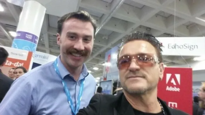Man posing with a celebrity lookalike at a convention, capturing a moment from funny Johnny Derp celebrity encounters.