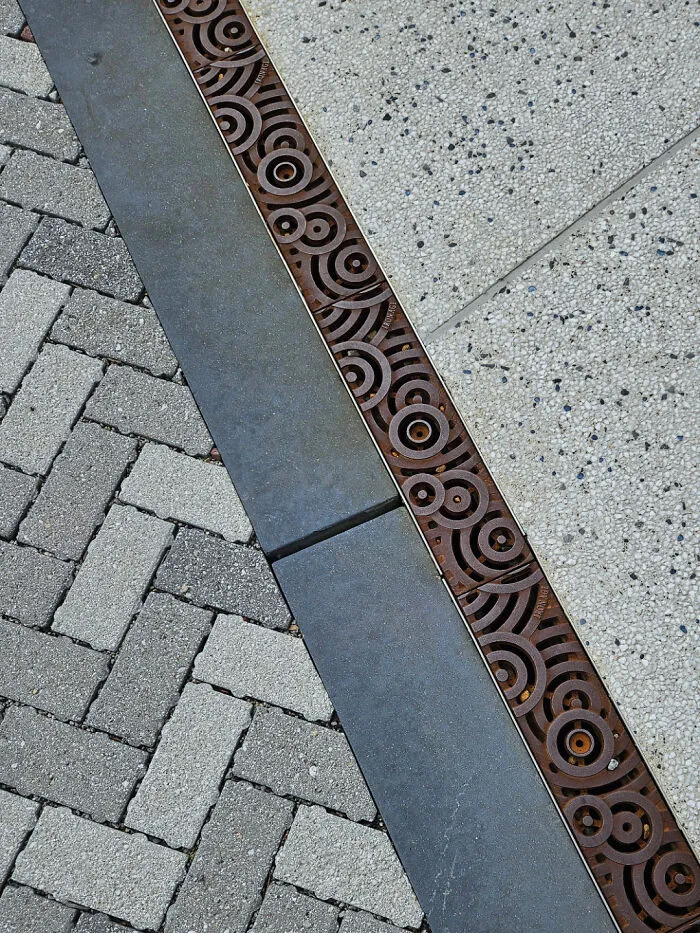 Storm Drain Covers Designed To Look Like Rain Hitting Water