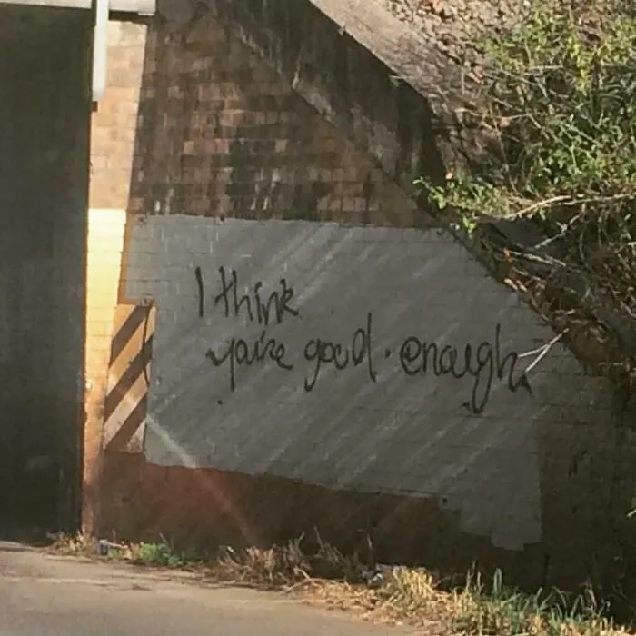 Graffiti vandalized public property with positive message I think you're good enough on a brick wall outdoors.