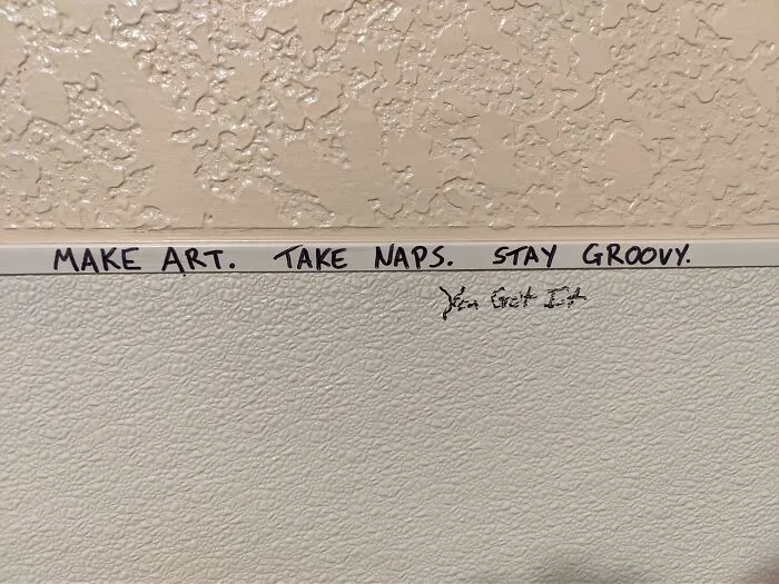Graffiti on public property saying make art, take naps, stay groovy, showcasing creative vandalism with positive messages.