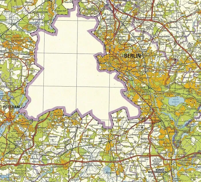 Vintage map showing Berlin and surrounding areas with detailed roads, borders, and landmarks in an informative map style.