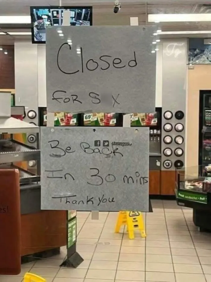 Handwritten sign on a store window saying closed for sex, combining funny and bizarre elements of holy and cursed images.