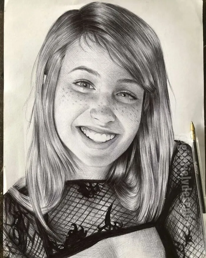 Realistic portrait of a smiling young woman created using only a ballpoint pen showcasing detailed artistry.