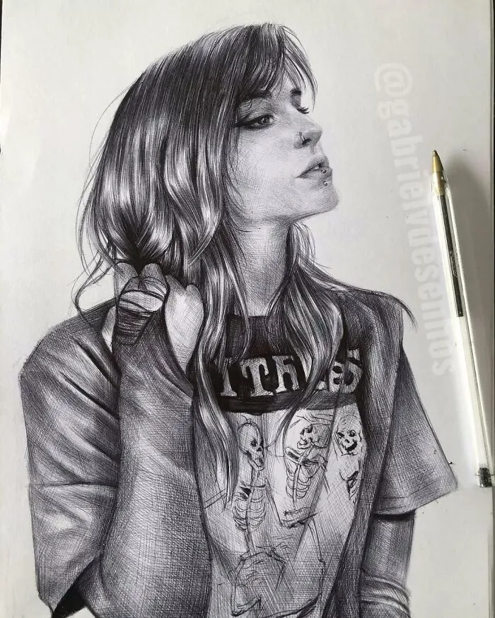 Realistic ballpoint pen portrait of a woman with long hair wearing a skeleton print shirt, showcasing detailed pen art.