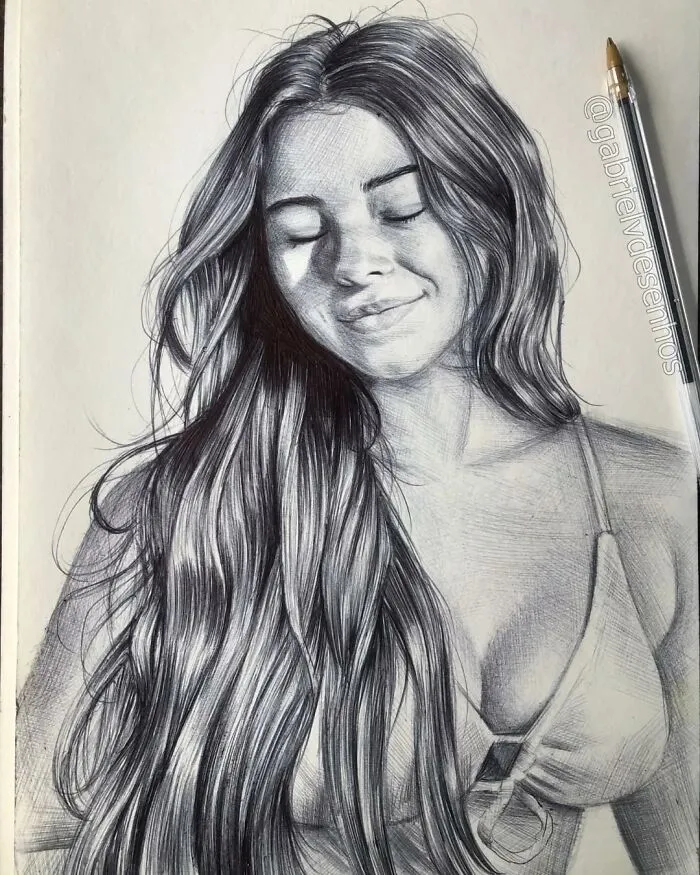 Realistic portrait drawing of a smiling woman with long hair created using only a ballpoint pen by the artist.