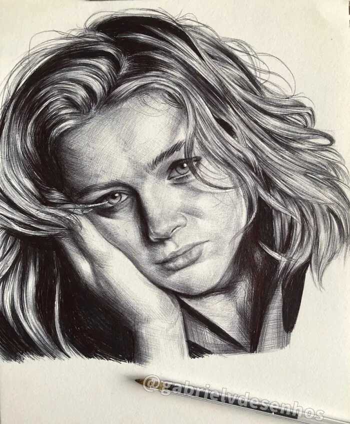 Detailed ballpoint pen portrait of a woman with flowing hair, showcasing realistic shading and photographic quality.