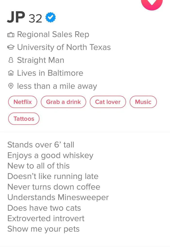 Tinder bio for a 32-year-old man highlighting personality traits, interests, and living in Baltimore in a dating profile.