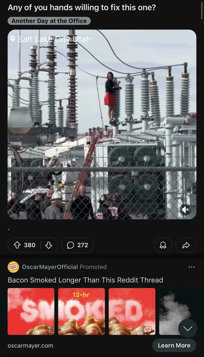 Woman in red skirt standing on high electrical equipment, an example of advertising placement fails that made people laugh.