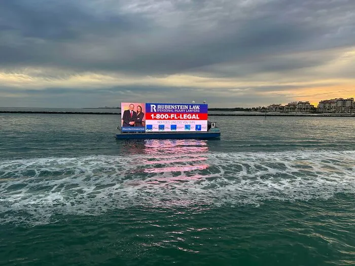 On A Beach Vacation, I Walked Out On A Pier To Watch The Sunset When This Hideous Electronic Billboard Cruised By Scrolling Ads In The Middle Of The Ocean