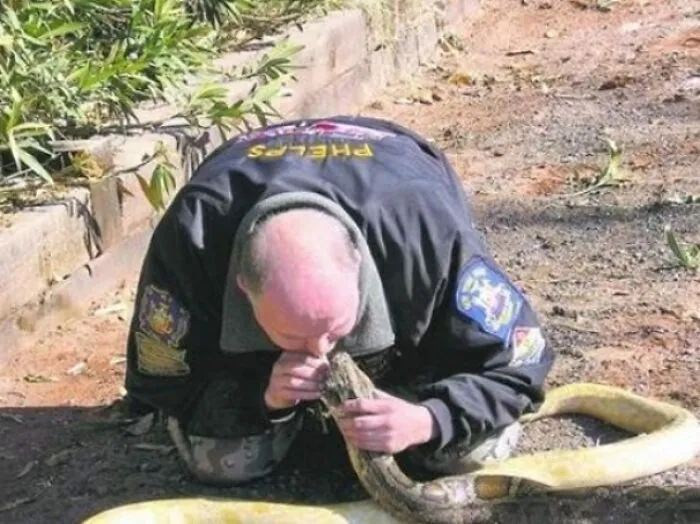 This Has To Be A First. A Firefighter Gives Mouth-To-Mouth To A Snake Suffering From Smoke Inhalation And Saves Its Life