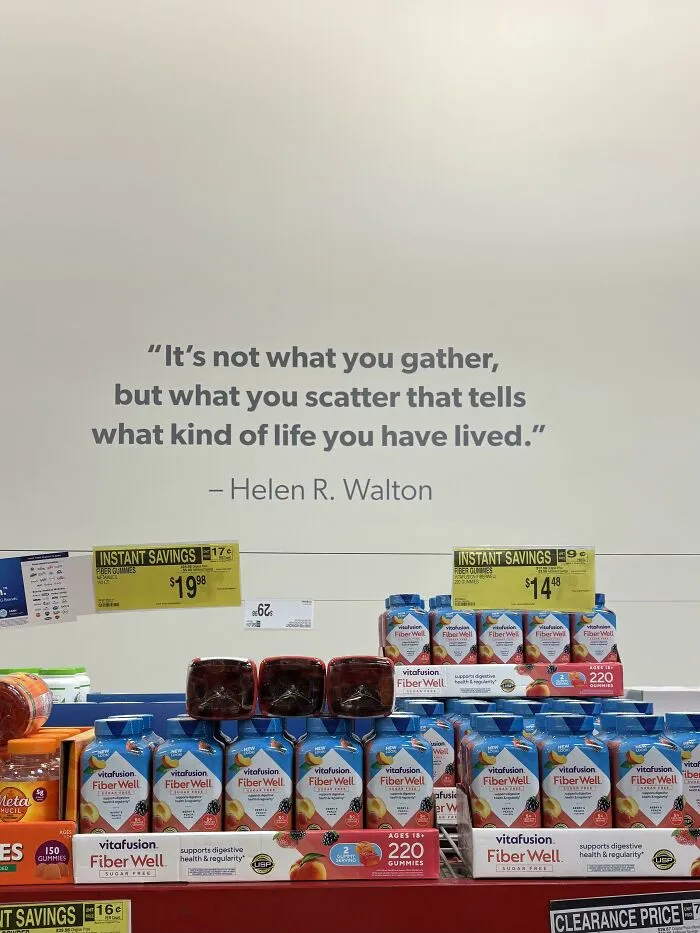 Display of Fiber Well gummies below a consumerism quote highlighting scattered life’s impact on gathering value.
