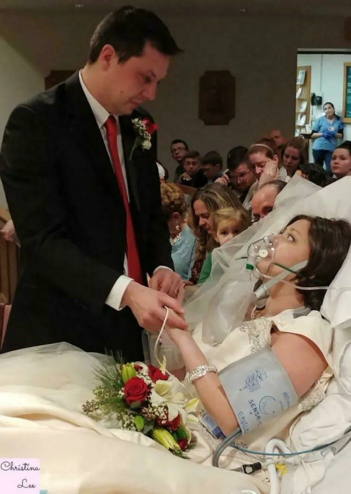 Bride on life support holding groom's hand in hospital bed, illustrating a still remains undiscovered to this day story.