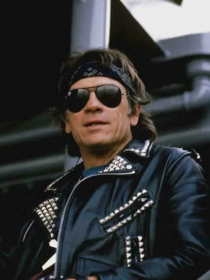 Man wearing studded leather jacket, bandana, and sunglasses representing funny ’90s posts and memes nostalgia.