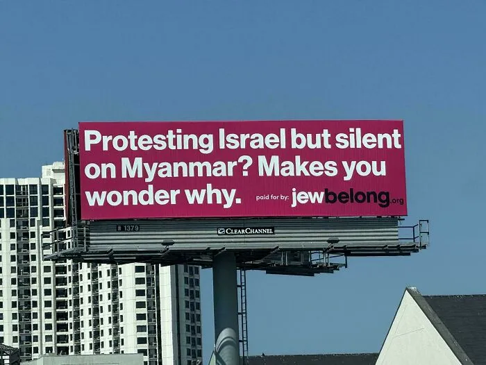Billboard with a controversial message about protests, highlighting an attempt fail in addressing complex political issues.