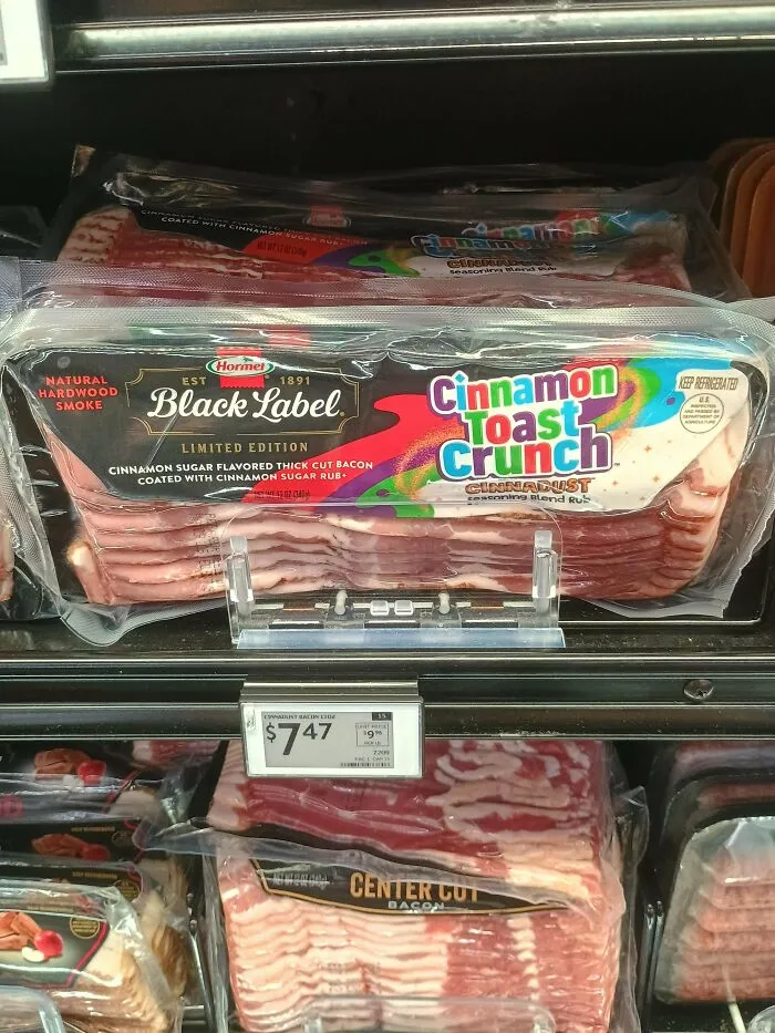 Package of limited edition Black Label Cinnamon Toast Crunch flavored bacon displayed in a supermarket cooler.