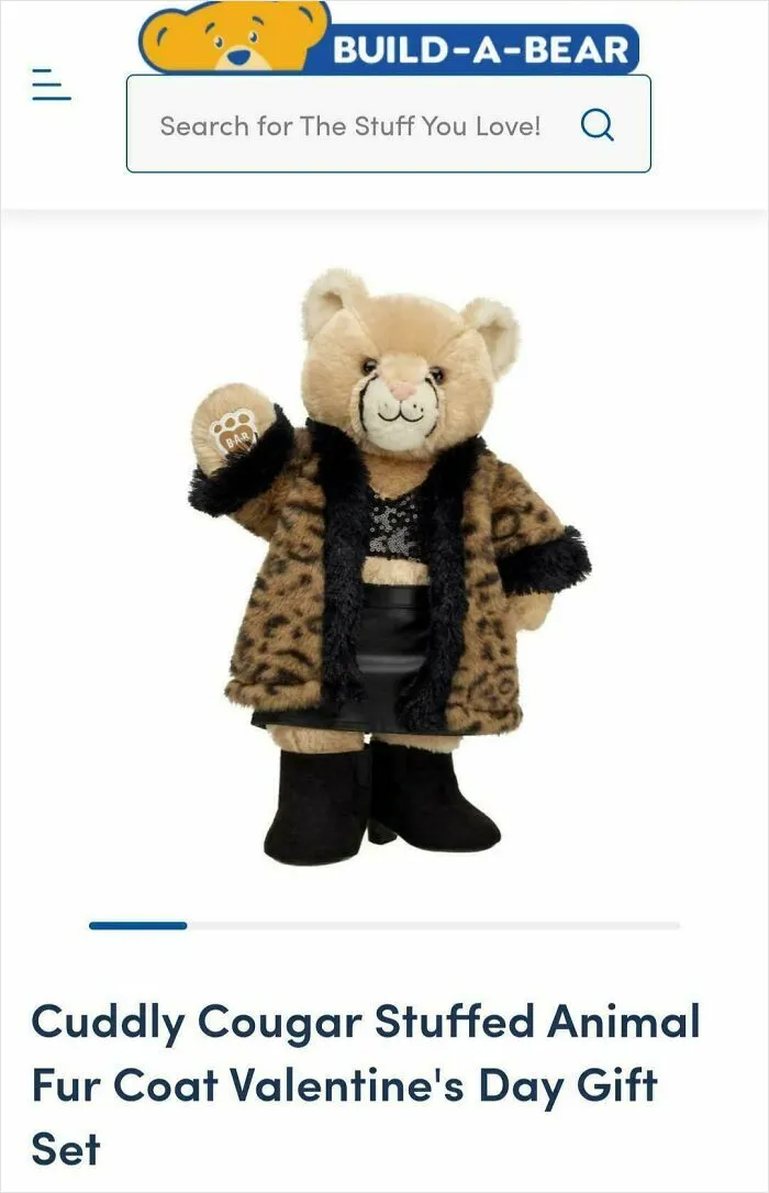 Cuddly cougar stuffed animal wearing a fur coat and boots, showcasing a quirky and nonsensical collectible toy.