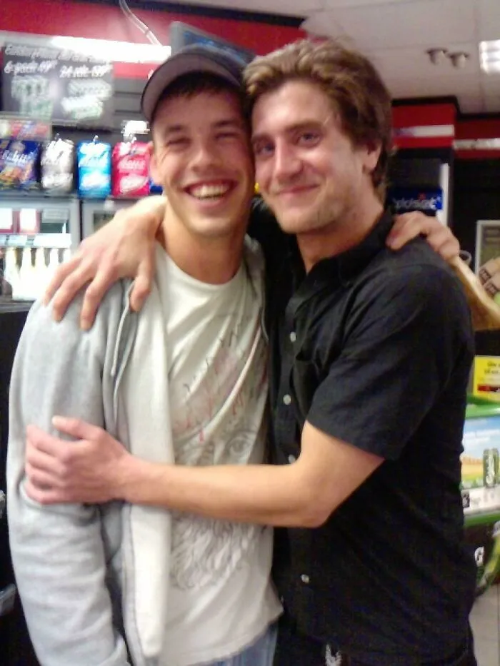 Two men smiling and hugging inside a store, featured in Johnny Derp celebrity photo fails shared online.