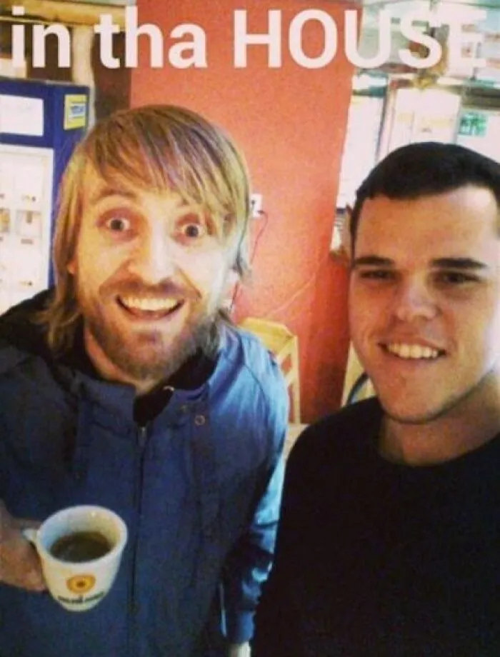 Two men smiling for a selfie in a casual setting, humorously linked to Johnny Derp celebrity photo fails.
