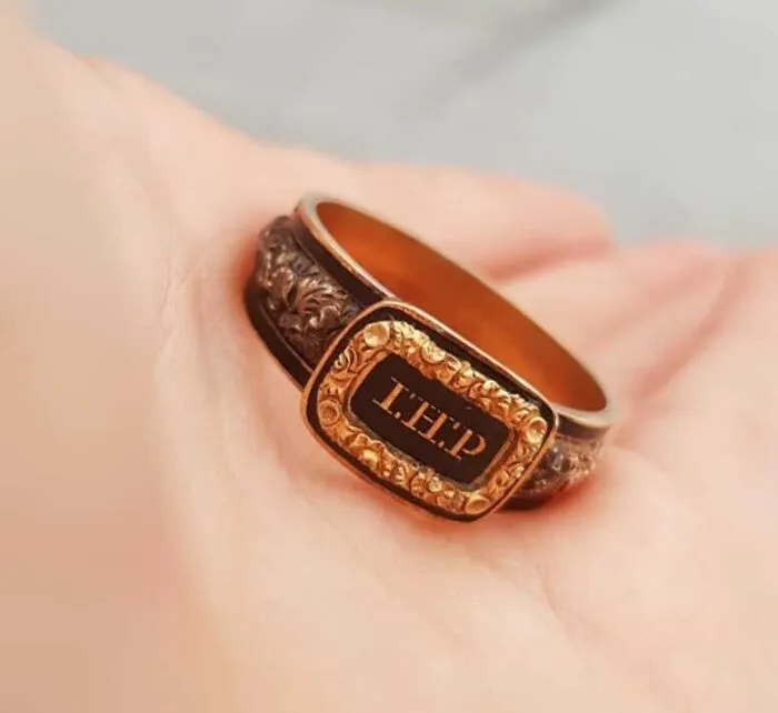 I Found This Ring In My Backyard While Doing Gardening. After Cleaning It, It Doesn't Look Like A Normal Ring. Any Ideas?