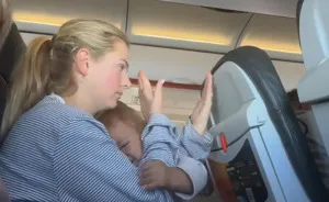 “Buy Another Seat”: Mom Sparks Outrage After Passenger Reclines Seat Into Her Lap