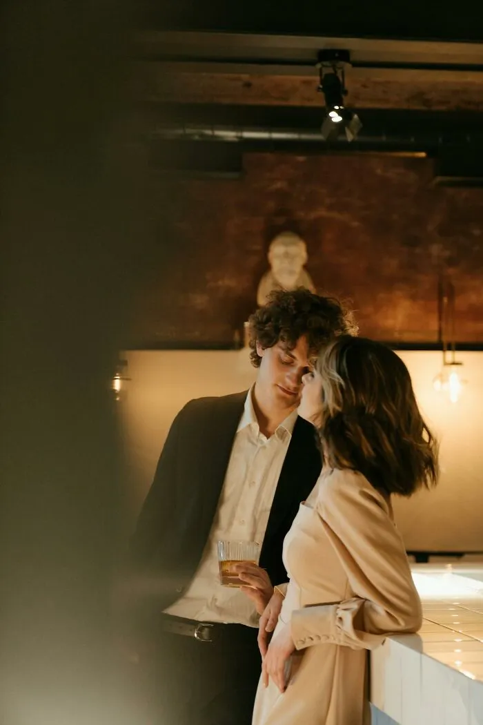 Two people in an intimate moment, illustrating the theme of being the villain in someone else's story.