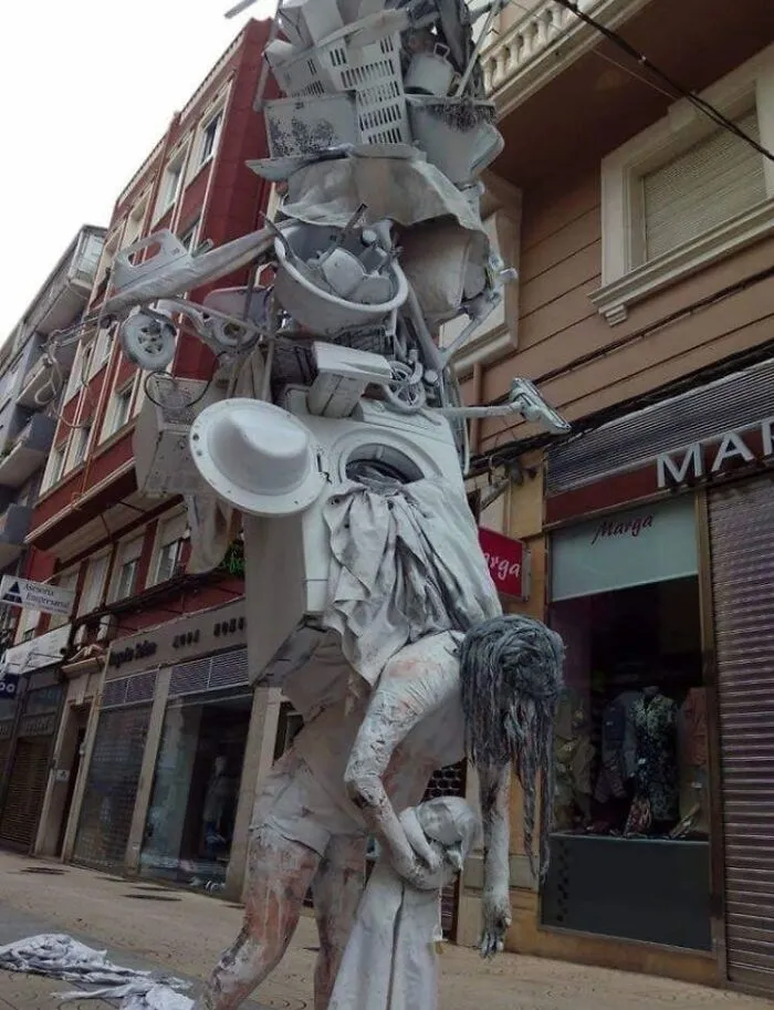 A Small Town In Spain Has A Huge Statue That Depicts The Overwhelming Weight That Mother Carries Towards Household And Raising A Child