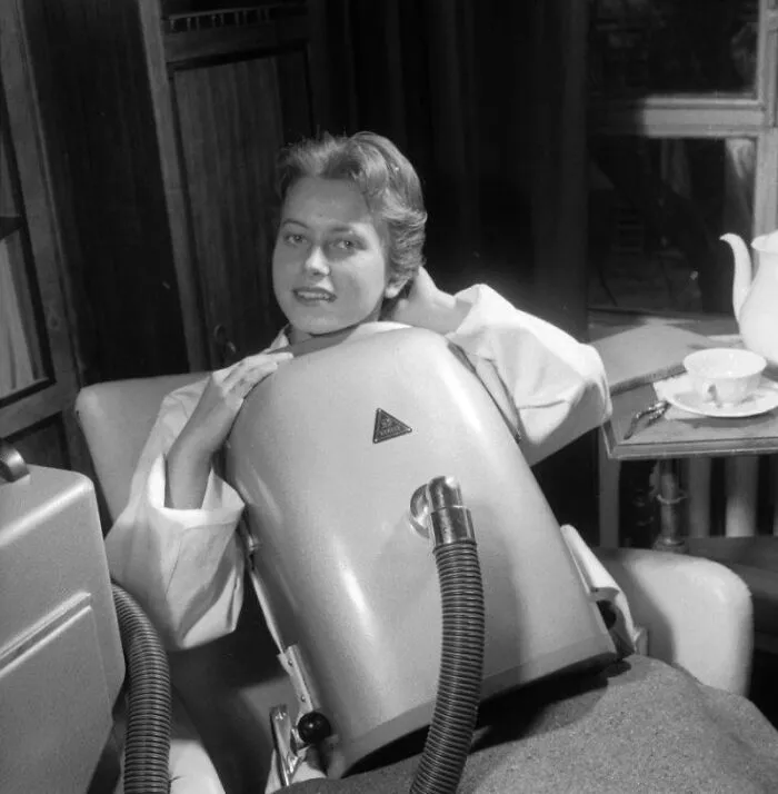 A Woman Tries On A Portable Respirator