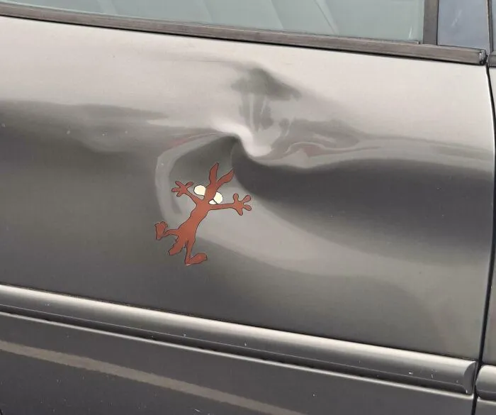 This Wile E. Coyote Sticker On This Car
