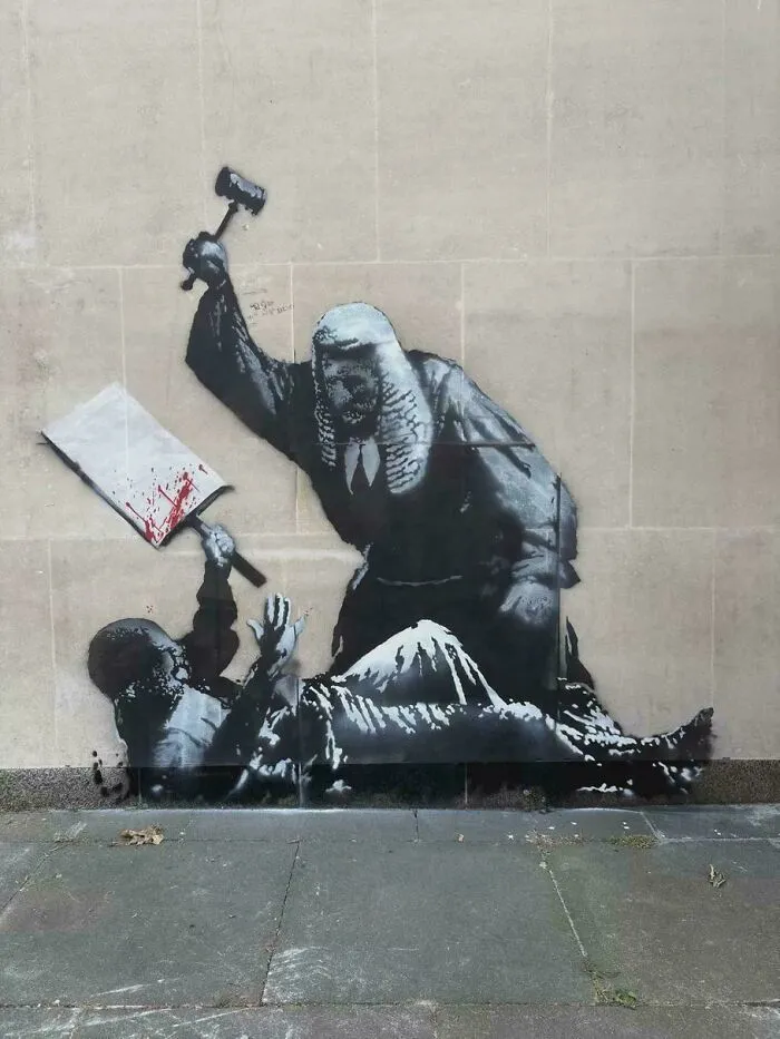 Banksy’s New Mural Outside London’s Royal Courts Of Justice — Already Covered