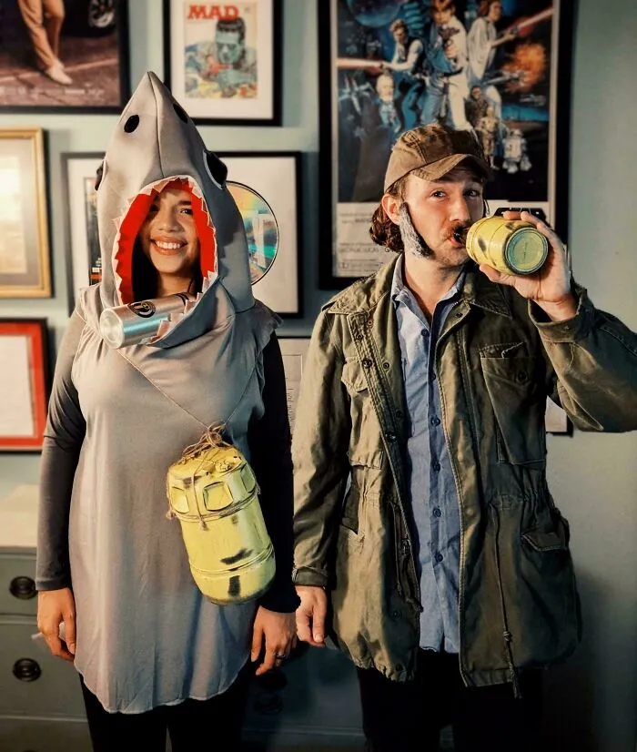 Couple in genius Halloween costumes with shark and fisherman outfits, instantly making people the talk of the party.