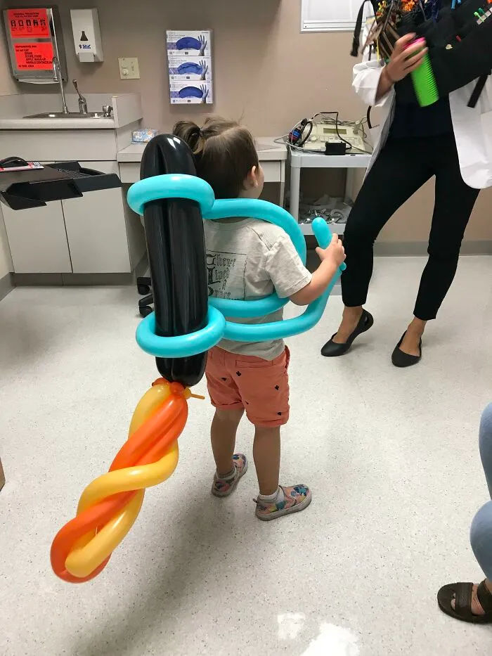 My Son’s Pediatrician Used To Be A Balloon Artist. She Made A Jet Pack For Him Today