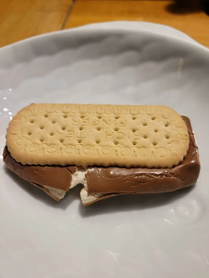 My Daughter Just Invented The British S'more. Milky Way Between 2 Rich Tea Fingers. Microwaved For 15 Seconds. It's So Wrong It's Right