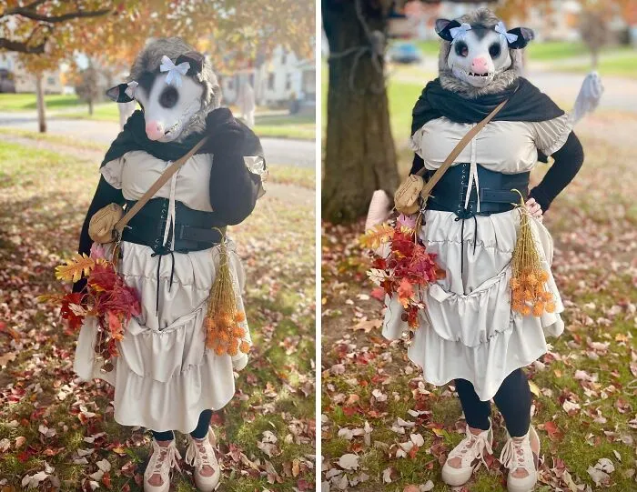 Person wearing a creative Halloween costume with an animal mask, layered dress, and autumn-themed accessories outdoors on fall leaves.