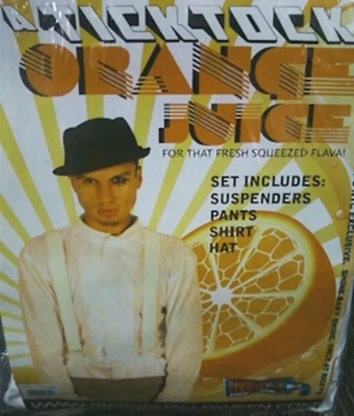 Off-brand Halloween costume resembling orange juice with suspenders, white shirt, and black hat.