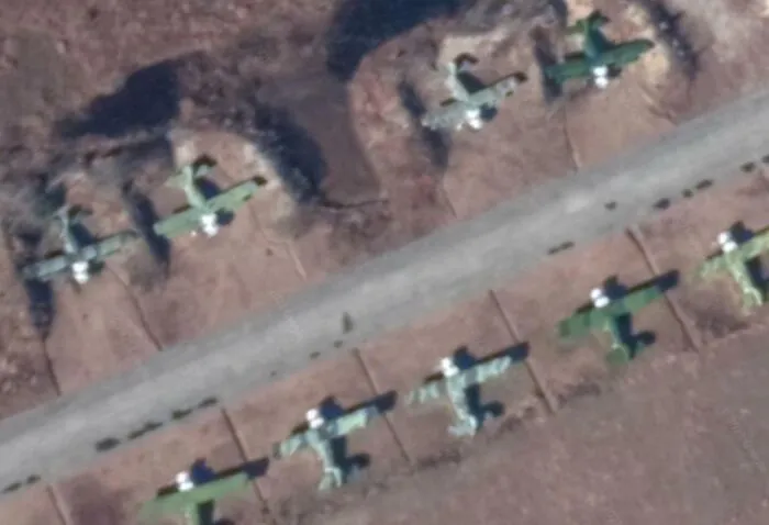 Aerial view of abandoned airplanes captured on Google Earth showing unexpected objects along an empty runway.